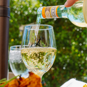 white wine pouring into glass